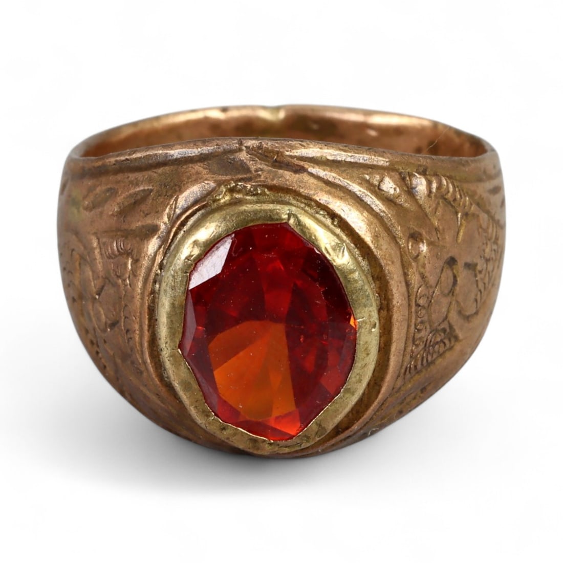 Antique Persian Style Red Glass Inlay Copper Alloy Ring, c. 19th-20th Century 7.5g: This antique copper alloy ring, dating to the 19th-20th century, reflects the bold yet practical jewelry styles of Persia and surrounding regions. The bezel holds a faceted red glass inlay, cut to res