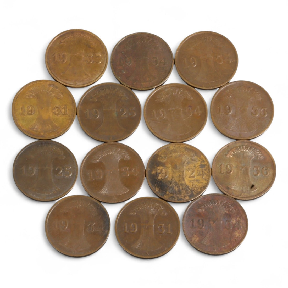 GERMANY: Interwar Resilience - 1 Reichspfennig Copper Coin Lot, 1923-1936: Comprising 14 copper coins minted between 1923 and 1936, this lot offers a deeply contextual snapshot of Germany's fraught interwar period. The obverses, inscribed Deutsches Reich, are rendered in bol