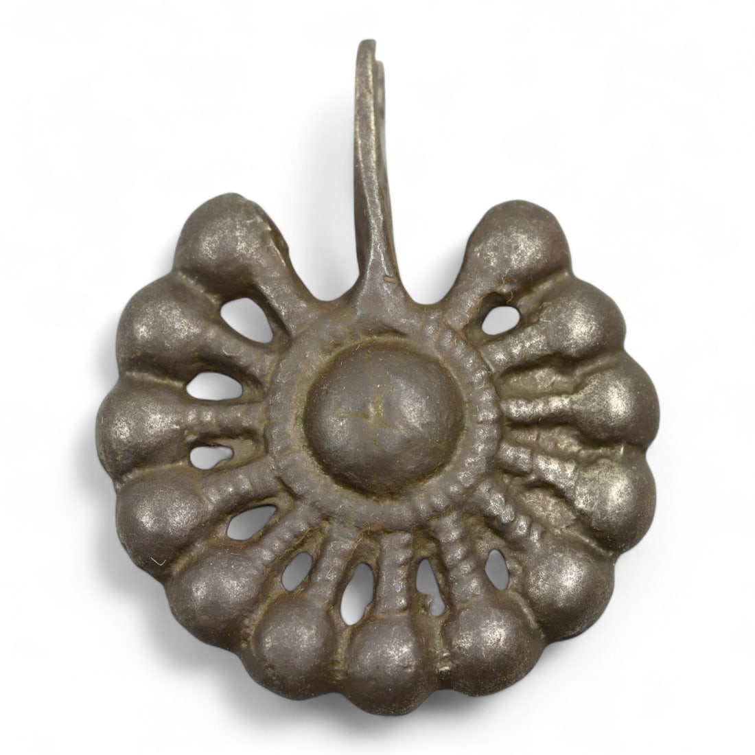 Ancient Roman Bronze Sunburst Pendant Amulet, c. 2nd-4th Century CE, 3.5g: This finely cast bronze pendant, designed in the form of a radiant sunburst, dates to the Roman Imperial period, c. 2nd-4th century CE. Likely worn as an amulet, this piece reflects the Roman fascinat