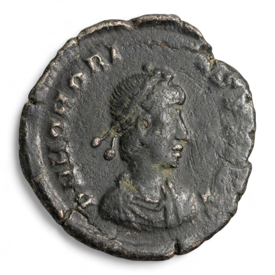 ROMAN EMPIRE: Imperial Authority - Bronze Coin, c. 1st-3rd Century AD, 20mm: Struck during the turbulent decades of the later Roman Empire, this 19mm bronze coin reflects the enduring symbolism of imperial control amidst crisis. Its compact yet deliberate design likely feature