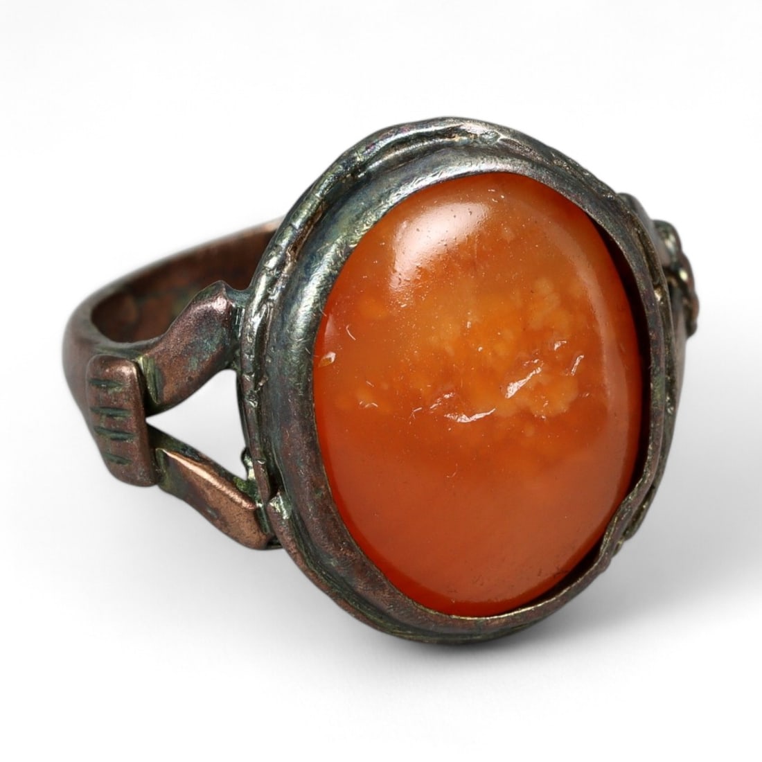 Antique Qajar Silver Ring with Fiery Carnelian Cabochon, c. 19th Century, 6g: This antique silver ring, dating to the Qajar dynasty of 19th century Persia, is set with a vibrant oval cabochon of orange-red carnelian. Celebrated in Persian and Islamic tradition, carnelian was re