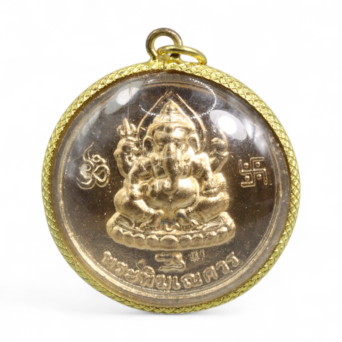 Thai Ganesha & Yaksha Dual-Sided Amulet in Round Gilt Case with Sanskrit Symbols, Modern Era, 20g: This powerful Thai amulet presents a dual-sided design honoring both the Hindu deity Ganesha and a crowned Yaksha guardian, united in a single medallion of spiritual might. On the front, Ganesha is re