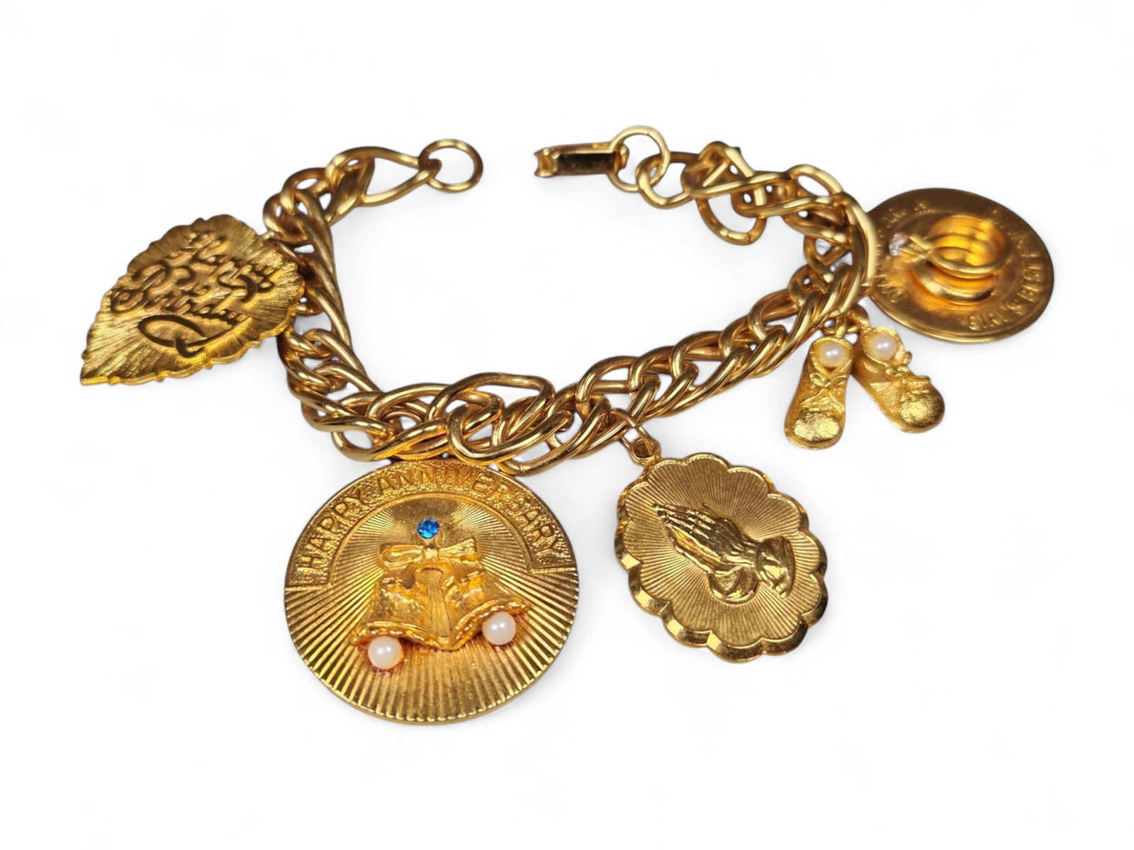 7cm Vintage Gold-Tone Charm Bracelet - Religious and Commemorative Motifs: This ornate 7 cm vintage gold-tone charm bracelet captures the beauty of sentimental jewelry with symbolic and celebratory details. Crafted with a bold chain link design, it features an array of textu