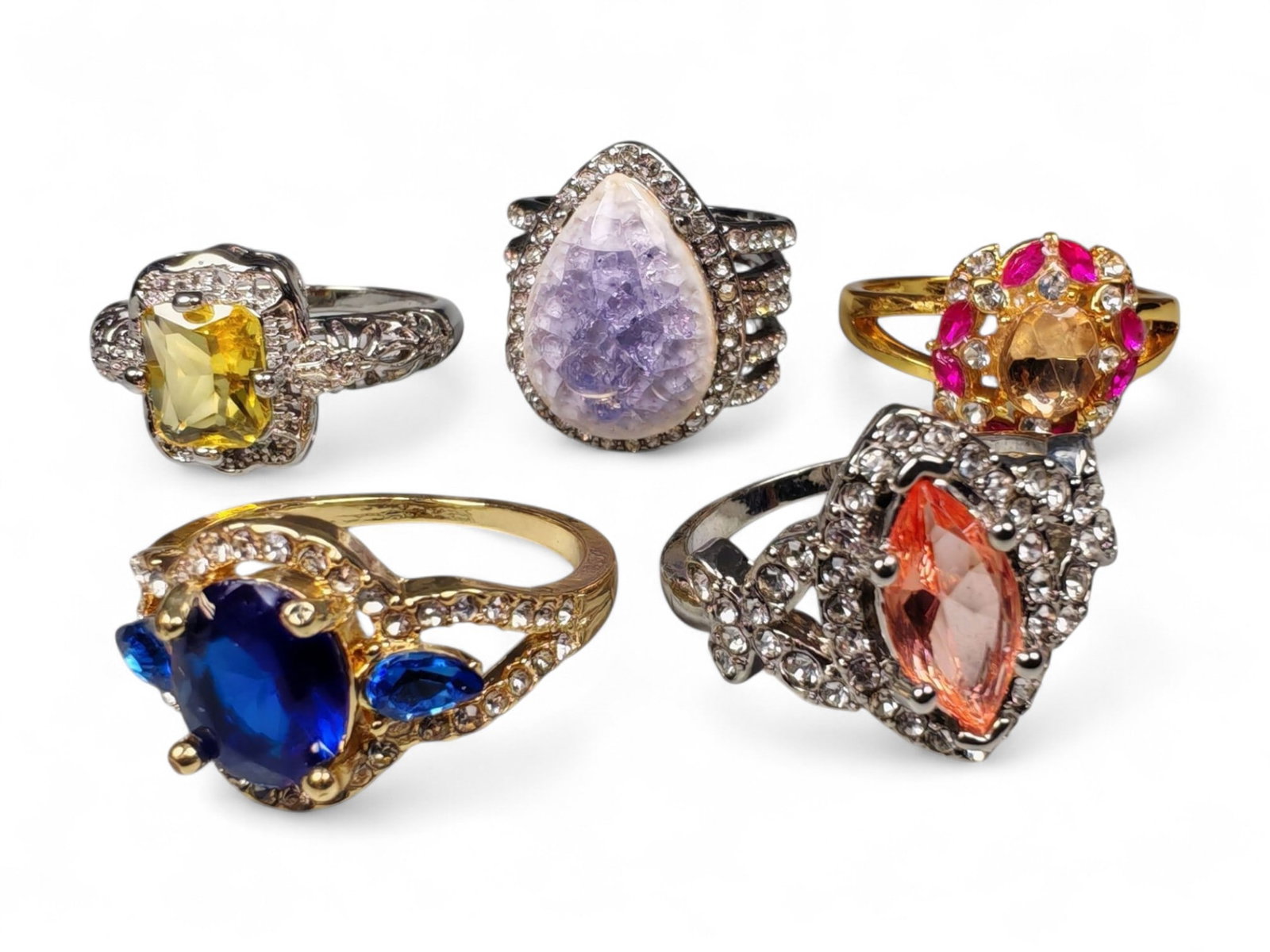 Lot of 5 Vintage and Contemporary Fashion Ring Lot, c. 20th-21st Century: This assorted lot of vintage and contemporary fashion rings offers a vibrant collection of statement pieces showcasing diverse styles, materials, and craftsmanship. Designed for decorative wear rather