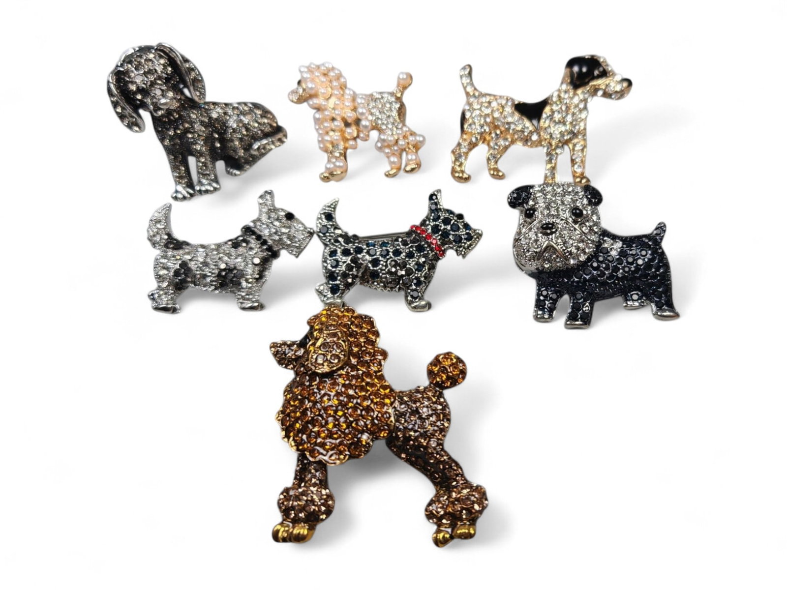 Set of Seven Dog Brooches - Crystal Pave and Pearl Accented Collection: This delightful seven-piece brooch collection celebrates beloved canine companions through elegant craftsmanship and sparkling design. Each brooch, ranging from 3 to 5 cm, is adorned with rhinestones,