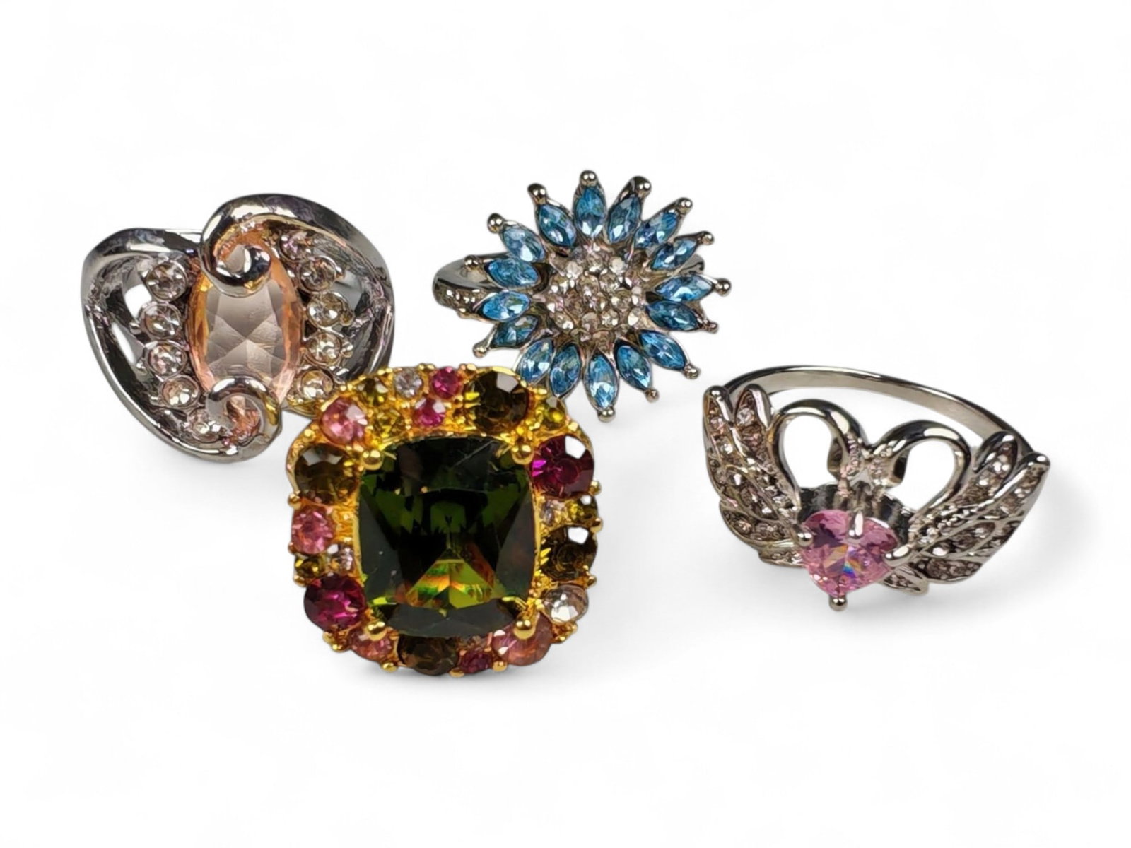 Lot of 4 Vintage and Contemporary Fashion Ring Lot, c. 20th-21st Century: This assorted lot of vintage and contemporary fashion rings offers a vibrant collection of statement pieces showcasing diverse styles, materials, and craftsmanship. Designed for decorative wear rather