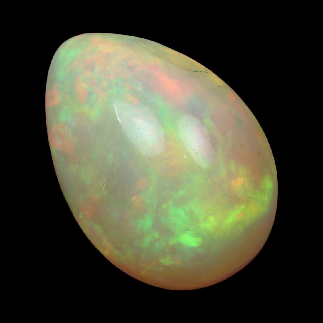 9.32 Carats Light Play-of-Color Opal Cabochon - Natural Ethiopian Stone: This elegant 17.1x12.6x8.9 mm Ethiopian opal glows with an ethereal inner fire, displaying soft flashes of green, orange, and pink across a delicate milky-white body tone. Its smooth, domed cabochon s