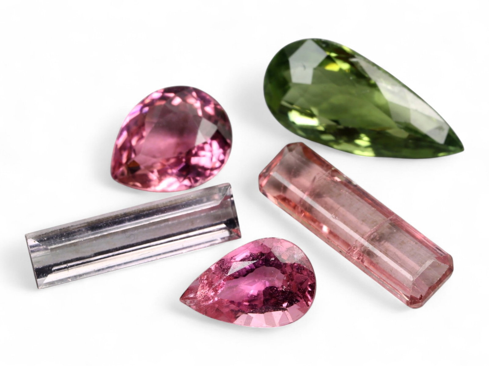 8.28 Carats Multicolor Faceted Tourmaline Selection - Natural Nigerian Stones: This captivating selection of faceted tourmalines displays a harmonious blend of natural hues, from deep olive green and soft lavender to rose pink and peach. Each stone reveals distinct optical life,