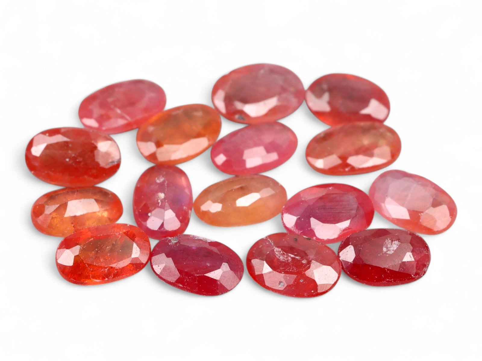 4.84 Carats Fiery Orange Faceted Sapphire Parcel - Natural Sri Lankan Stones: This lively parcel of faceted sapphires radiates with a vivid medley of orange, reddish-orange, and warm coral hues. Each gem, averaging 4.8 x 3.2 x 1.6 mm, captures light with a brilliant internal gl