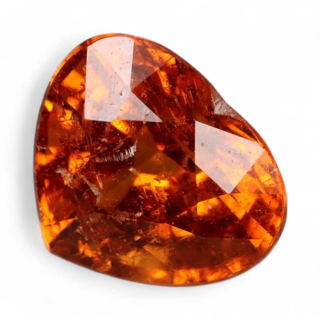 2.98 Carats Golden-Orange Faceted Songea Sapphire - Natural Tanzanian Stones: This vibrant of Songea sapphires glows with a fiery palette ranging from deep amber and burnt orange to bright golden honey tones. Each gem, averaging 8.6x7.4x5.7 mm, is expertly faceted to maximize b