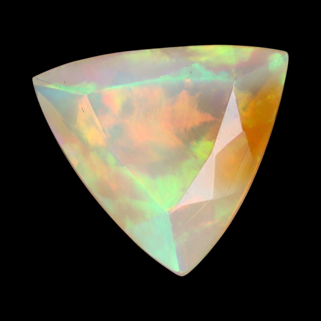 2.79 Carats Faceted Welo Opal - Natural Ethiopian Stone: This graceful 11.2x11x6.2 mm Ethiopian opal radiates a soft yet vibrant play-of-color, with hues of green, orange, and rose blending harmoniously beneath its faceted surface. The gem displays a fluid 