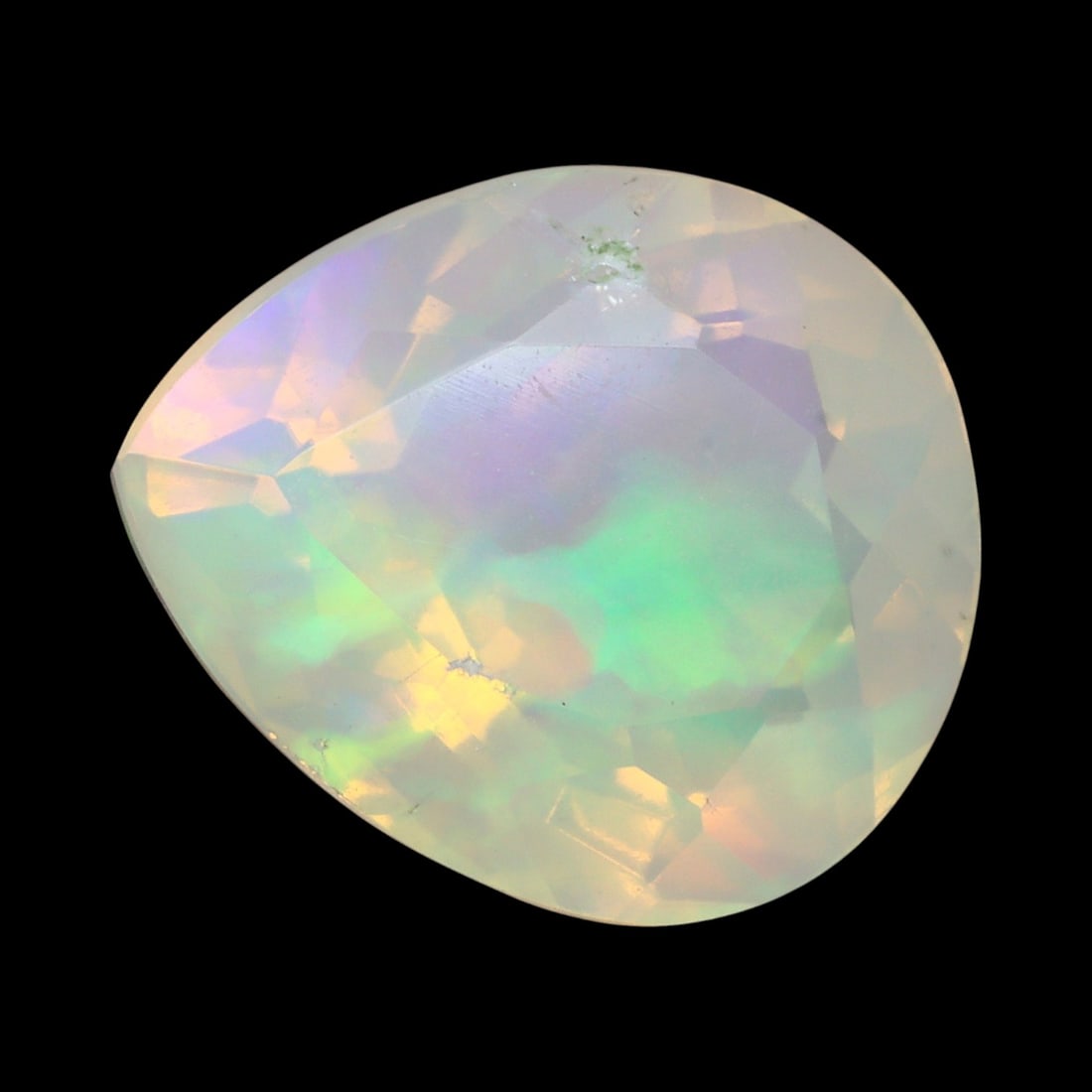 2.87 Carats Faceted Welo Opal - Natural Ethiopian Stone: This graceful 11.4x9.6x7.4 mm Ethiopian opal radiates a soft yet vibrant play-of-color, with hues of green, orange, and rose blending harmoniously beneath its faceted surface. The gem displays a fluid