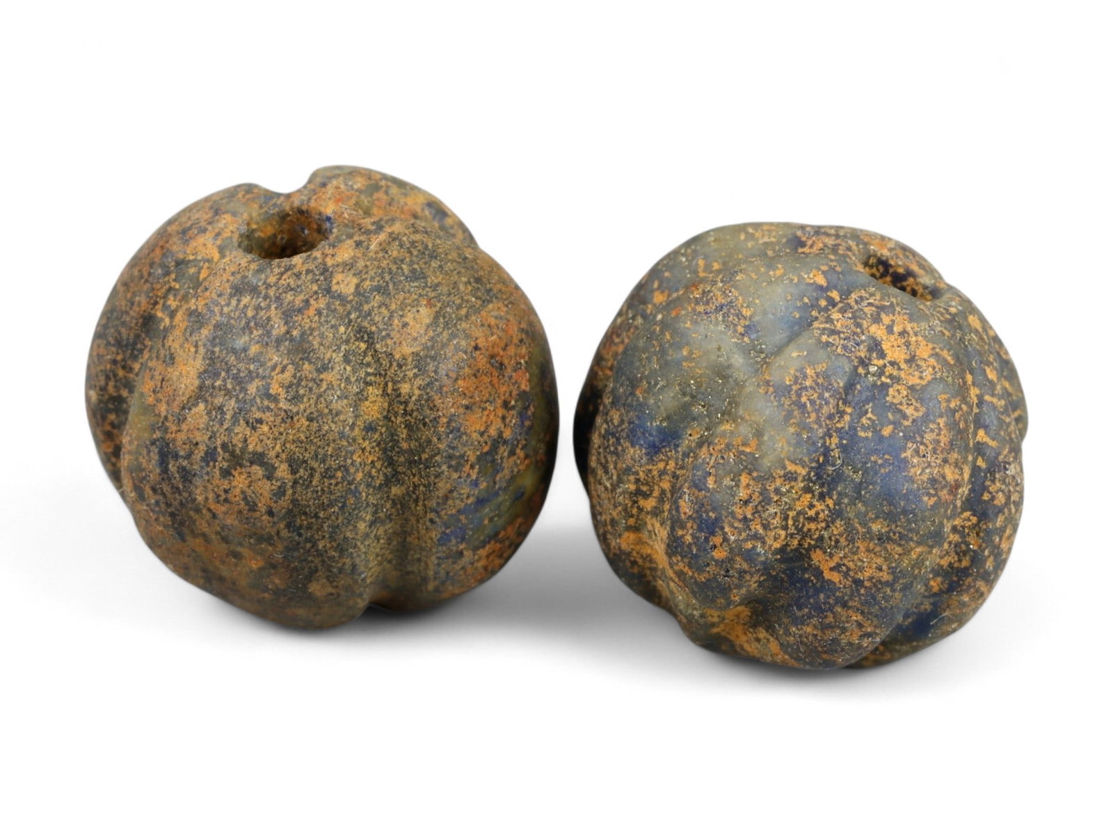 Ancient Neo-Assyrian Pair of Lapis Lazuli Melon-Shaped Beads, c. 9th-7th Century BCE, 1.5cm, 6g: This pair of carved lapis lazuli beads, formed in the classic melon shape, dates to the Neo-Assyrian period, c. 9th-7th century BCE. Beads of this type were both decorative and symbolic, strung into n