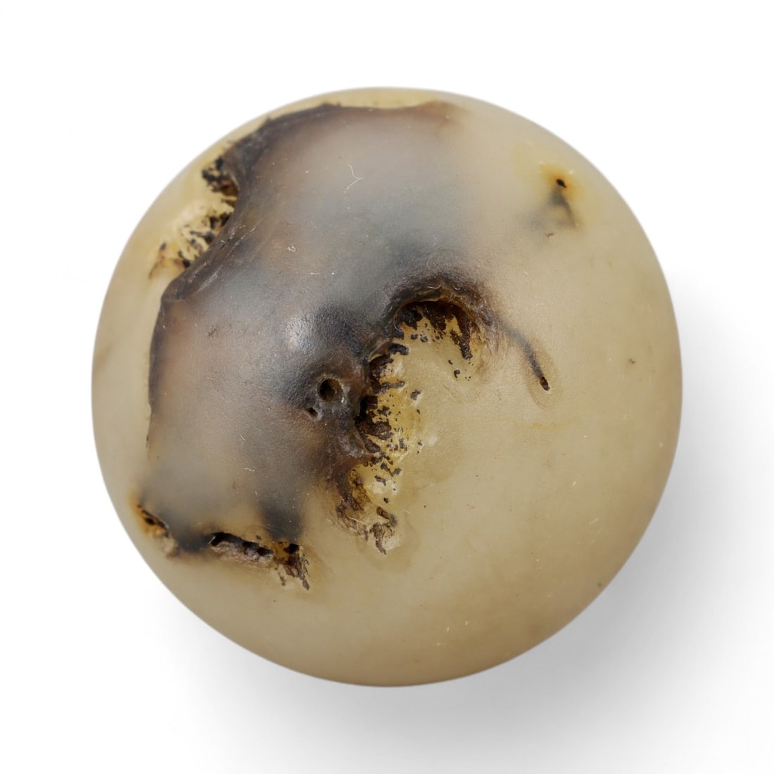 Ancient Himalayan Banded Agate Spherical Dzi Bead, c. 3rd-7th Century CE, 2.2cm: This elegant spherical bead, carved from natural agate and measuring 2 cm, exemplifies the refined simplicity of Himalayan Dzi tradition. Its smooth, rounded form reveals delicate layers of cream, smo