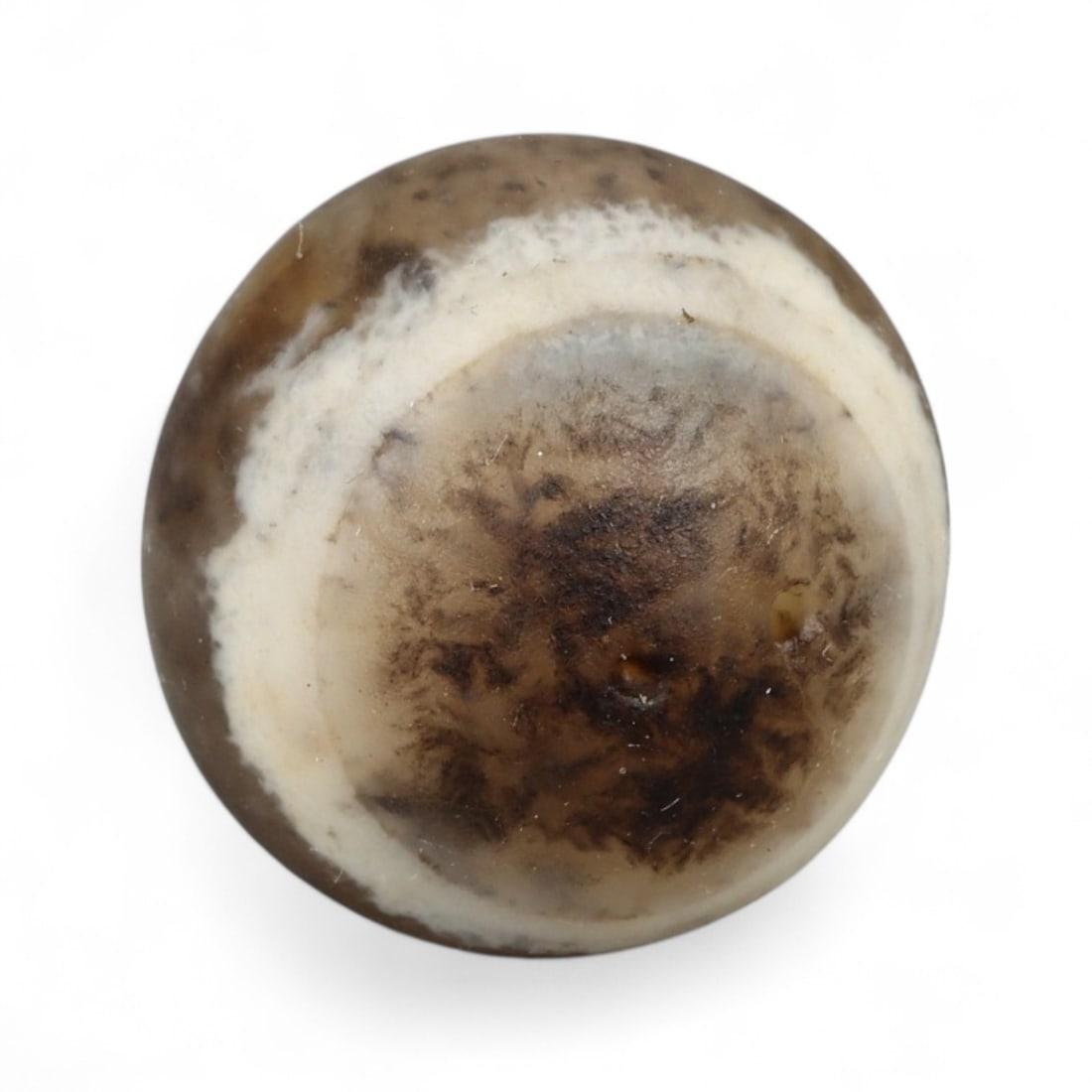 Ancient Himalayan Eye Agate Dzi Bead, c. 3rd-7th Century CE, 1.4cm: This remarkable spherical bead, measuring 2 cm, belongs to the class of ancient Dzi beads that have long been revered in Tibet and the wider Himalayan world. Its defining feature is the concentric "ey