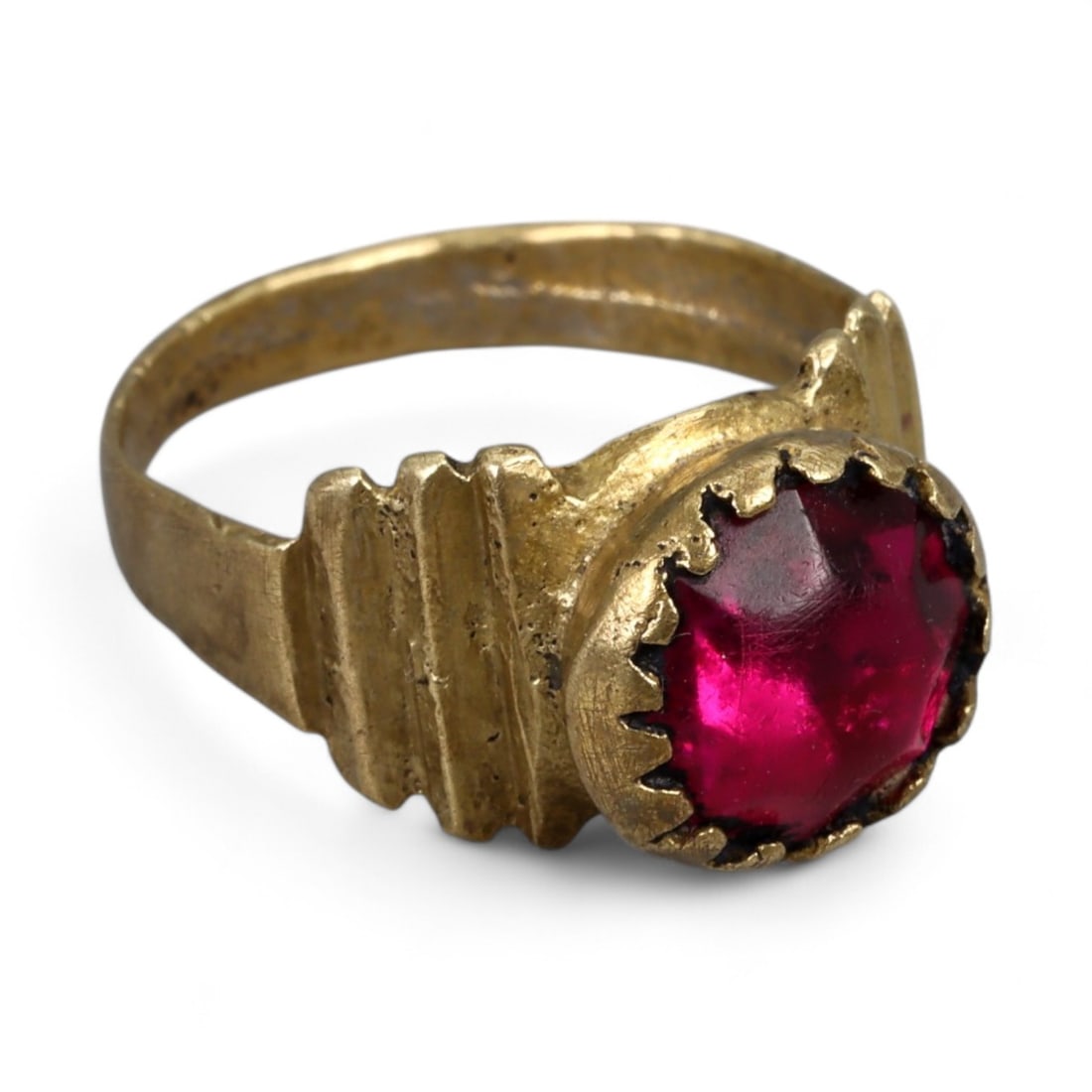 Antique Central Asian Gilt-Silver Red Cabochon Ring, c. 19th-20th Century 4g: This elegant antique ring reflects the refined jewelry traditions of Central Asia during the late Qajar and early 20th-century era. Its bezel holds a vivid red cabochon, likely glass imitating garnet