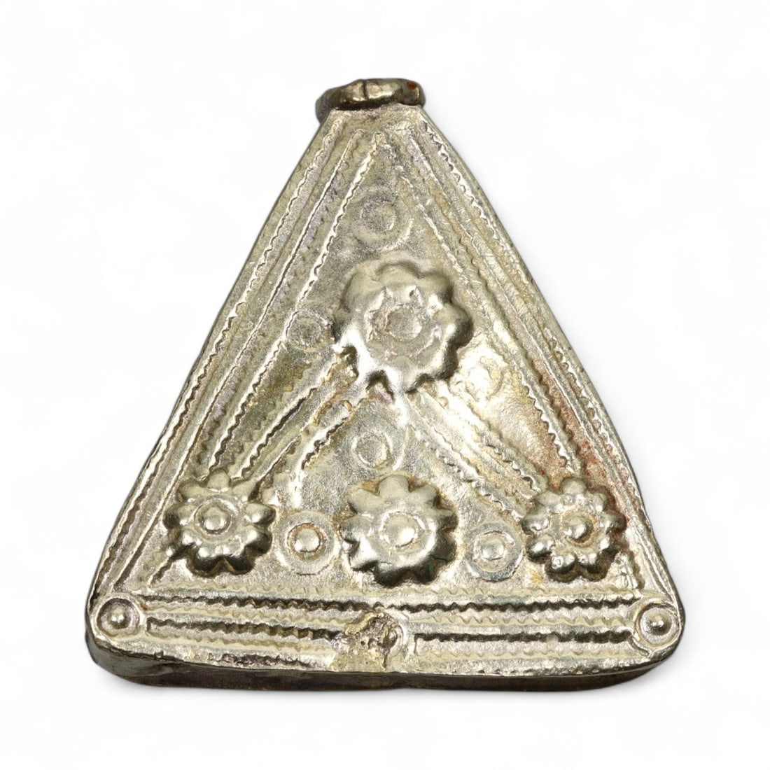 Antique Himalayan Triangular Silver Amulet Pendant, c. 19th Century, 4.5cm: This striking triangular silver amulet pendant originates from the Himalayan cultural region, most likely Nepal or Tibet, and dates to the 19th century. Such pendants, often worn suspended from a neck
