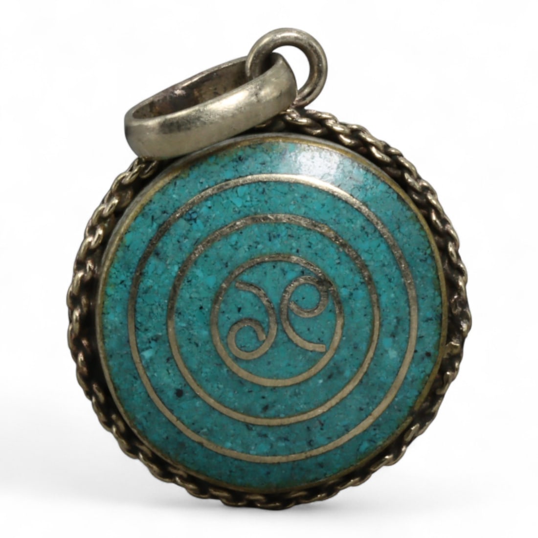Vintage Tibetan Silver and Cloisonne Enamel Pendant, c. Mid-20th Century, 3cm: This vintage Tibetan pendant, dating to the mid-20th century, is a fine example of cloisonne enamel artistry. The pendant is set in a silver frame with a twisted rope border, enclosing a vibrant clois
