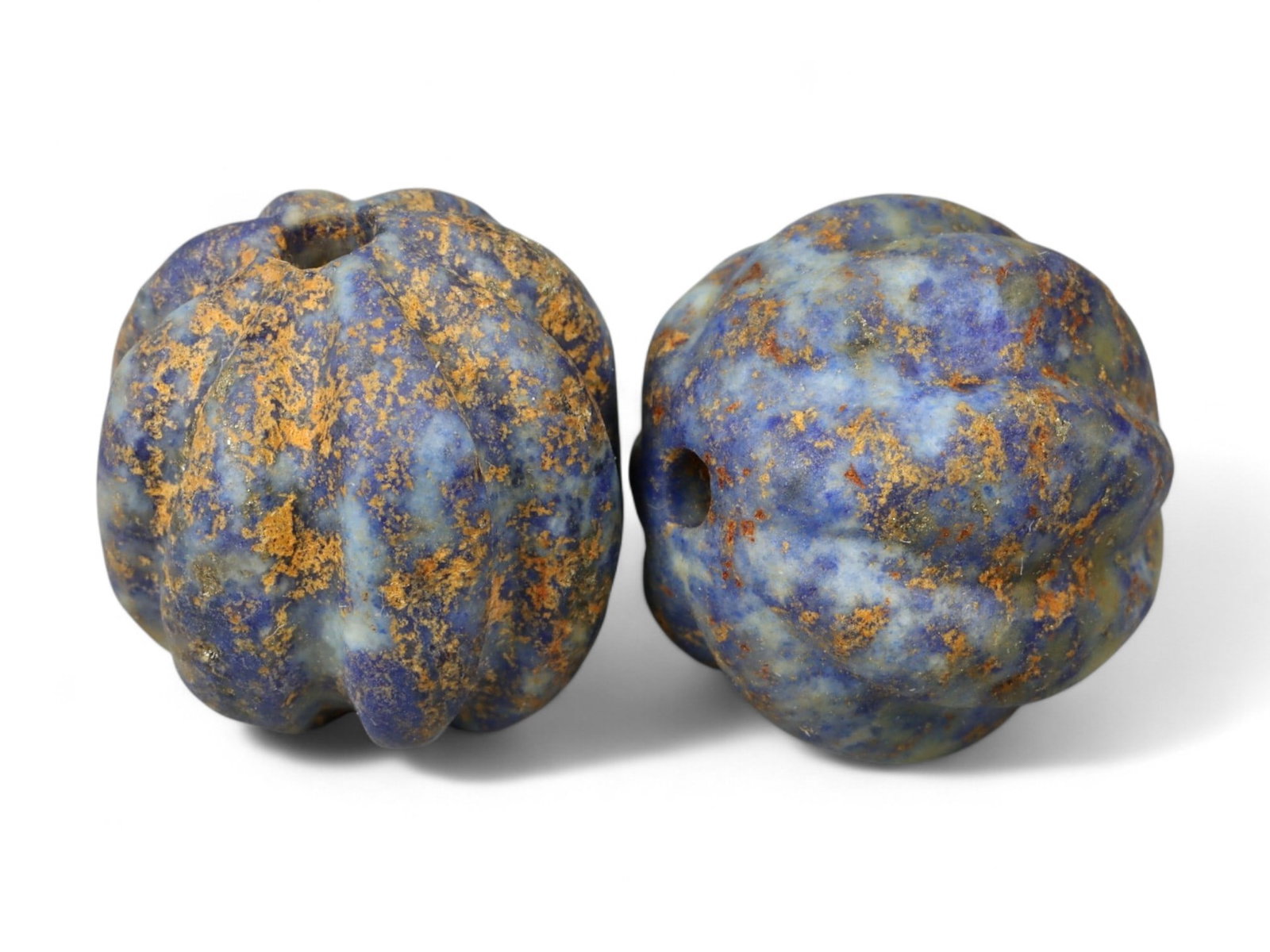 Ancient Neo-Assyrian Pair of Lapis Lazuli Melon-Shaped Beads, c. 9th-7th Century BCE, 1.5cm, 7.6g: This pair of carved lapis lazuli beads, formed in the classic melon shape, dates to the Neo-Assyrian period, c. 9th-7th century BCE. Beads of this type were both decorative and symbolic, strung into n