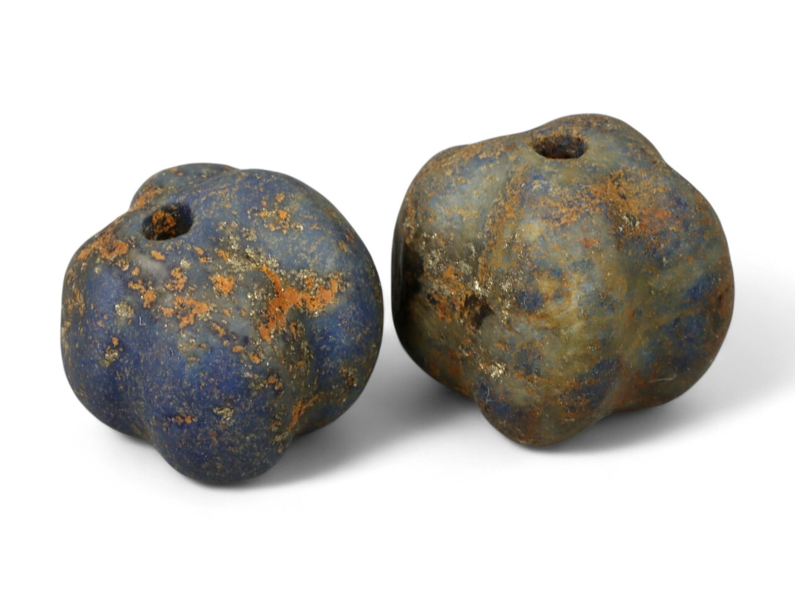 Ancient Neo-Assyrian Pair of Lapis Lazuli Melon-Shaped Beads, c. 9th-7th Century BCE, 1.5cm, 6g: This pair of carved lapis lazuli beads, formed in the classic melon shape, dates to the Neo-Assyrian period, c. 9th-7th century BCE. Beads of this type were both decorative and symbolic, strung into n