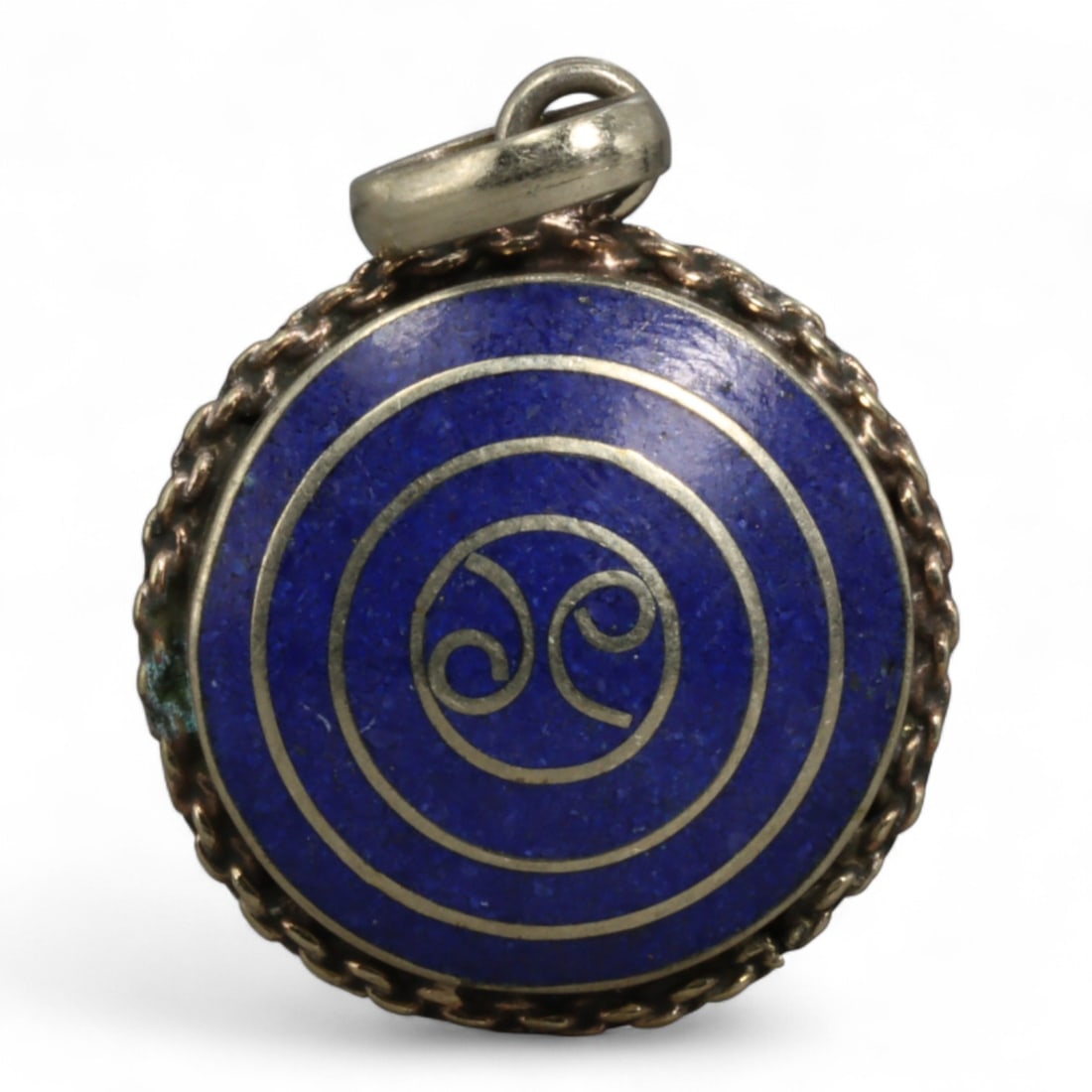 Vintage Tibetan Silver and Cloisonne Enamel Pendant, c. Mid-20th Century, 3cm: This vintage Tibetan pendant, dating to the mid-20th century, is a fine example of cloisonne enamel artistry. The pendant is set in a silver frame with a twisted rope border, enclosing a vibrant clois