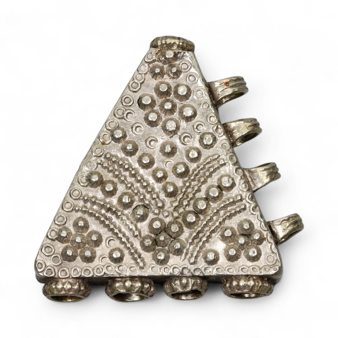 Antique Himalayan Triangular Silver Amulet Pendant, c. 19th Century, 4.5cm: This striking triangular silver amulet pendant originates from the Himalayan cultural region, most likely Nepal or Tibet, and dates to the 19th century. Such pendants, often worn suspended from a neck