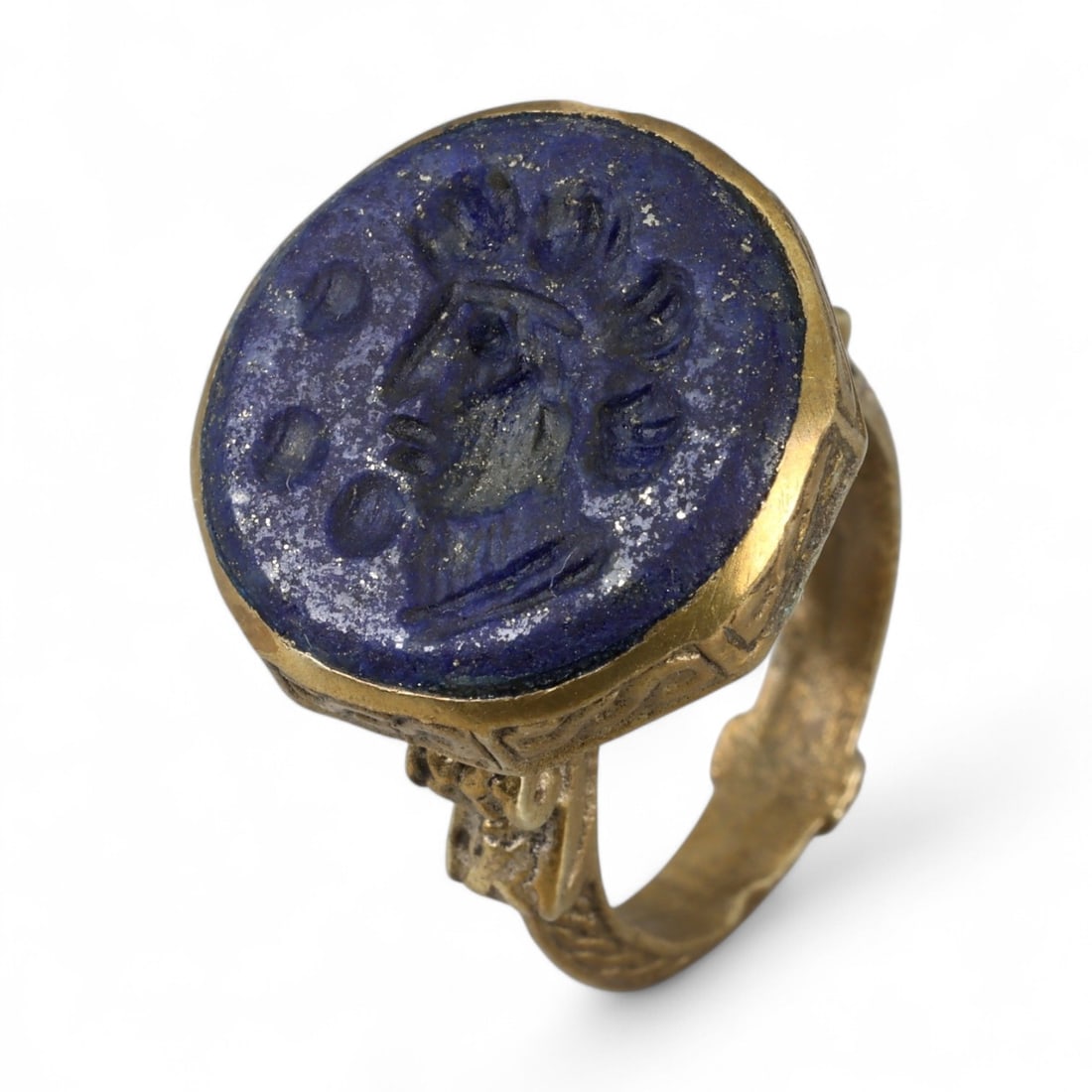 Antique Central Asian Intaglio Lapis Glass Gilt-Silver Ring, c. 19th-20th Century 10g: This remarkable antique ring reflects the deep cultural connections of Central Asia during the late Qajar and early modern period, blending classical imagery with regional craftsmanship. The bezel is