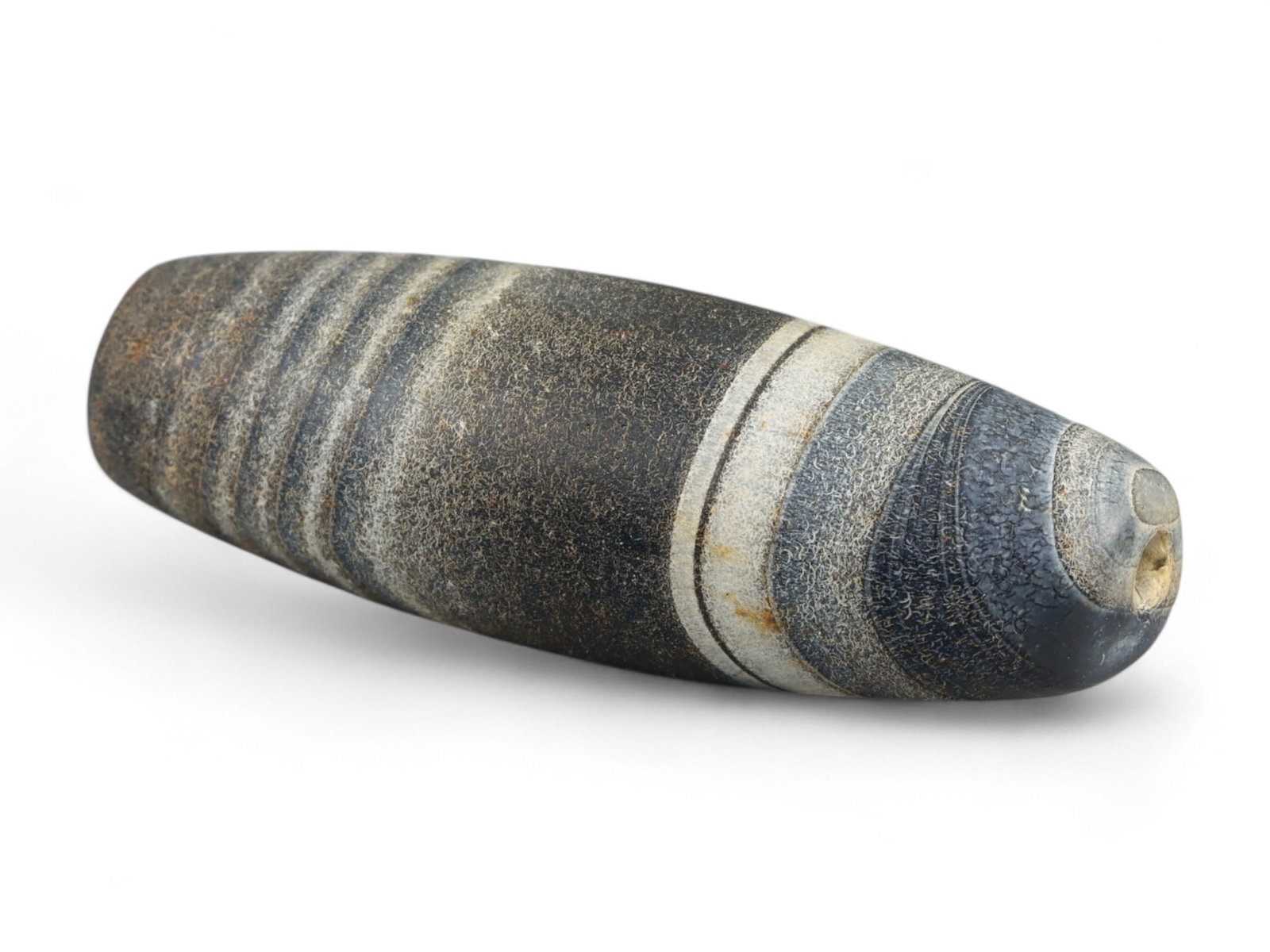 Ancient Gandhara Banded Sulaimani Agate Bead, c. 1st-3rd Century CE, 3cm: This striking banded agate bead, often referred to as a Sulaimani bead, originates from the Gandhara region, c. 1st-3rd century CE, during the height of the Kushan Empire. Gandhara, straddling present