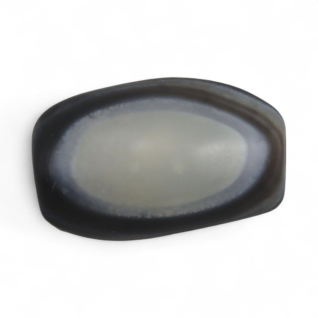 Antique Himalayan Banded Agate Amulet Bead, c. 15th-17th Century, 2.2cm: This bead, carved from banded agate with smoky brown and gray tones, dates to the Himalayan region between the 15th and 17th centuries. Its elongated oval form, shows concentric layering, a characteri