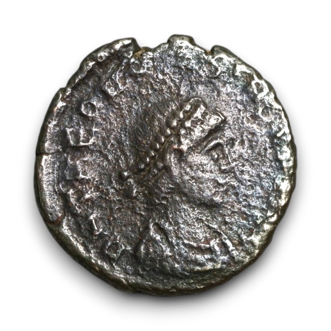 ROMAN EMPIRE: Imperial Authority - Bronze Coin, c. 1st-3rd Century AD, 13mm: Struck during the turbulent decades of the later Roman Empire, this bronze coin reflects the enduring symbolism of imperial control amidst crisis. Its compact yet deliberate design likely featured an