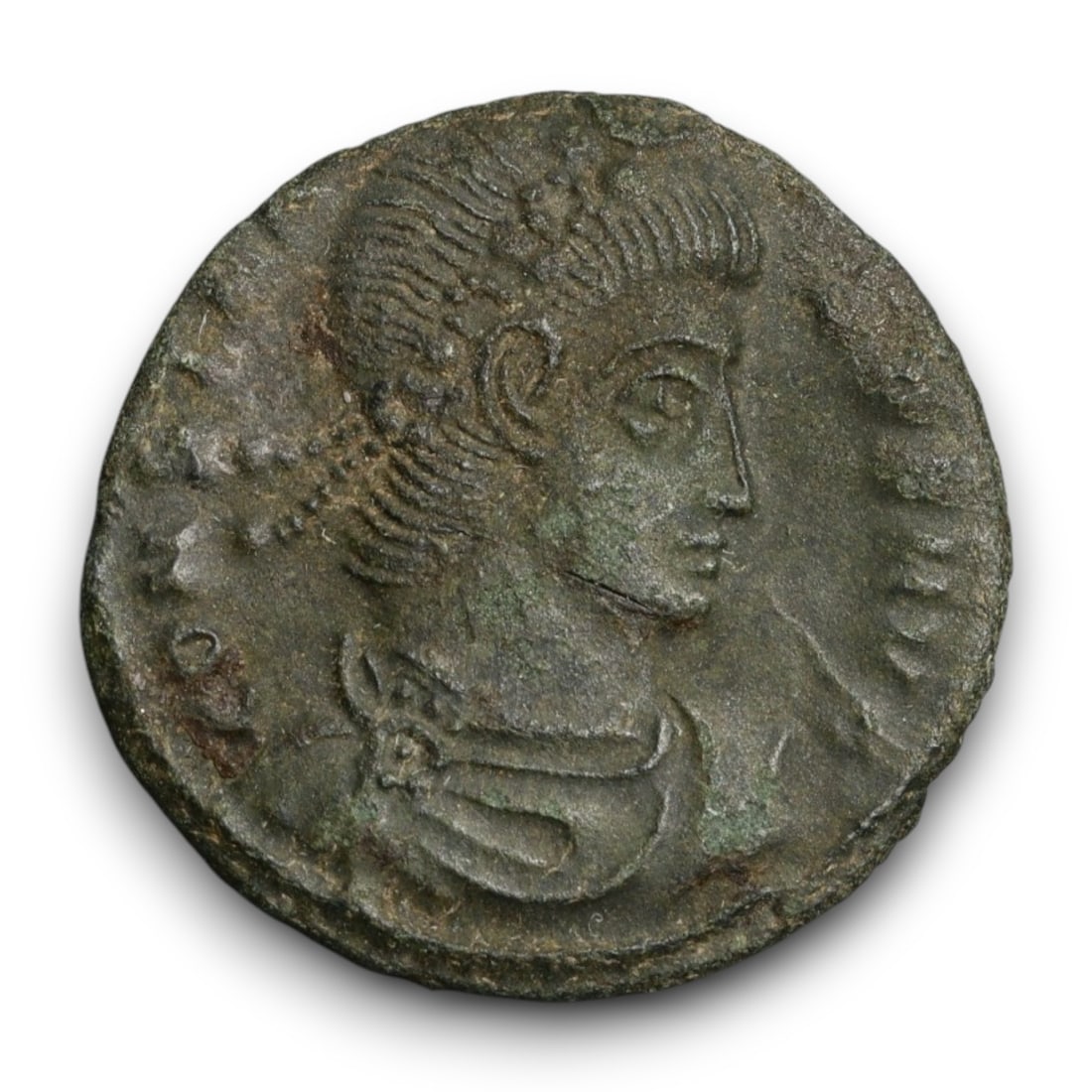 ROMAN EMPIRE: Imperial Authority - Bronze Coin, c. 1st-3rd Century AD, 15mm: Struck during the turbulent decades of the later Roman Empire, this 19mm bronze coin reflects the enduring symbolism of imperial control amidst crisis. Its compact yet deliberate design likely feature