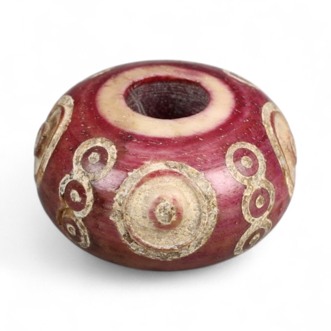 Ancient Medieval Nishapur Silk Road Bone Spindle Whorl, c. 9th-11th Century CE, 1.6cm: This finely carved spindle whorl originates from Nishapur, an important Silk Road city in medieval northeastern Iran, dating to approximately the 9th-11th century CE. Such spindle whorls were essentia