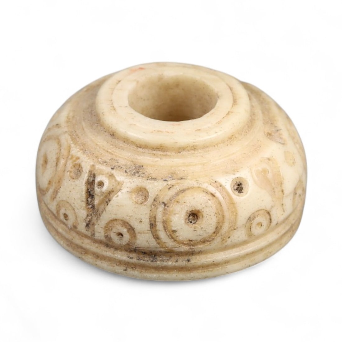 Ancient Medieval Nishapur Silk Road Bone Spindle Whorl, c. 9th-11th Century CE, 1.8cm: This finely carved spindle whorl originates from Nishapur, an important Silk Road city in medieval northeastern Iran, dating to approximately the 9th-11th century CE. Such spindle whorls were essentia