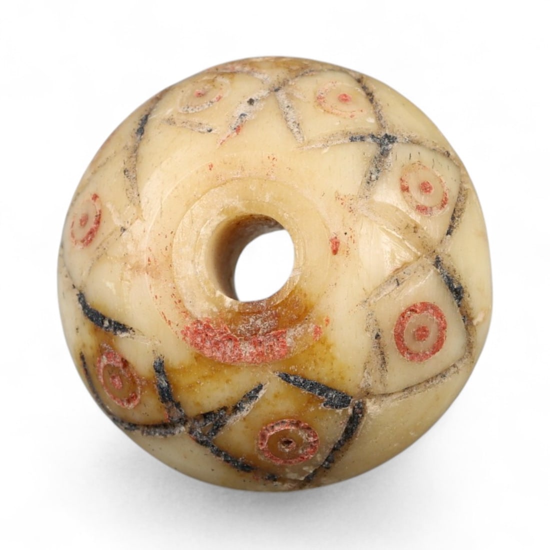 Ancient Medieval Nishapur Silk Road Bone Spindle Whorl, c. 9th-11th Century CE, 2cm: This finely carved spindle whorl originates from Nishapur, an important Silk Road city in medieval northeastern Iran, dating to approximately the 9th-11th century CE. Such spindle whorls were essentia