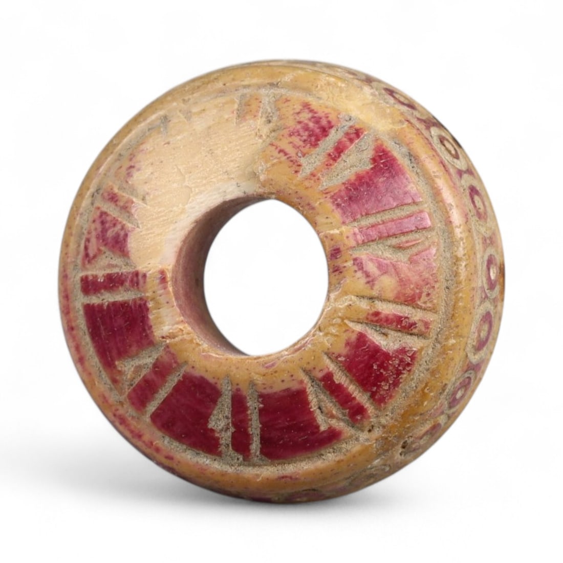 Ancient Medieval Nishapur Silk Road Bone Spindle Whorl, c. 9th-11th Century CE, 1.8cm: This finely carved spindle whorl originates from Nishapur, an important Silk Road city in medieval northeastern Iran, dating to approximately the 9th-11th century CE. Such spindle whorls were essentia