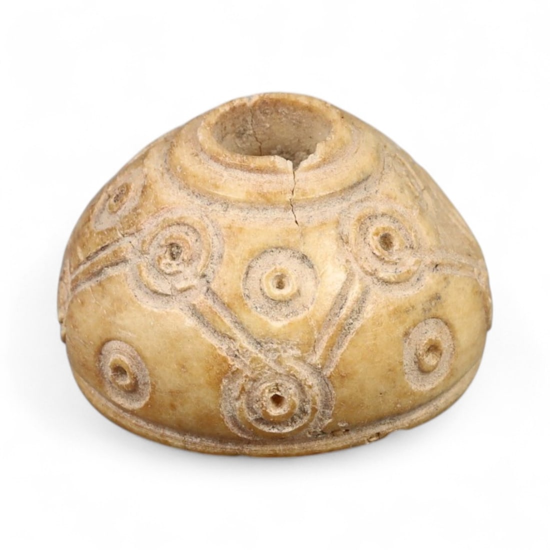 Ancient Medieval Nishapur Silk Road Bone Spindle Whorl, c. 9th-11th Century CE, 1.8cm: This finely carved spindle whorl originates from Nishapur, an important Silk Road city in medieval northeastern Iran, dating to approximately the 9th-11th century CE. Such spindle whorls were essentia