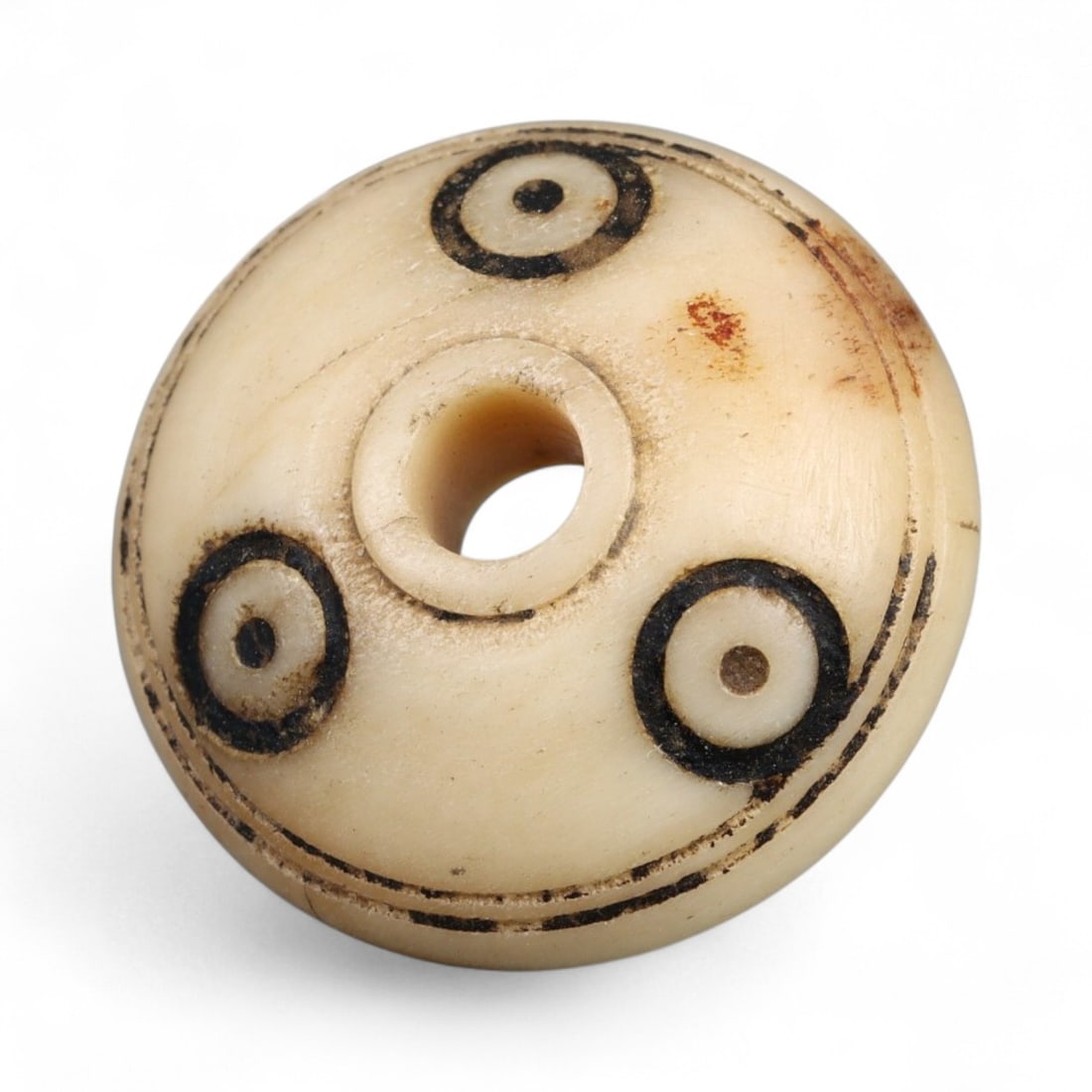 Ancient Medieval Nishapur Silk Road Bone Spindle Whorl, c. 9th-11th Century CE, 2.2cm: This finely carved spindle whorl originates from Nishapur, an important Silk Road city in medieval northeastern Iran, dating to approximately the 9th-11th century CE. Such spindle whorls were essentia