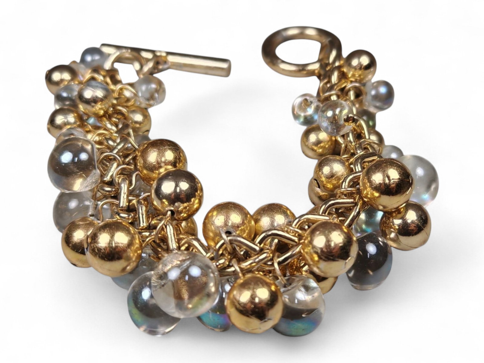 20cm Gold and Crystal Bead Bracelet - Cluster Charm Design: This striking 20 cm bracelet combines the brilliance of gold-tone metal with the soft luminosity of glass crystal beads, creating a luxurious, multi-dimensional effect. The design features alternating