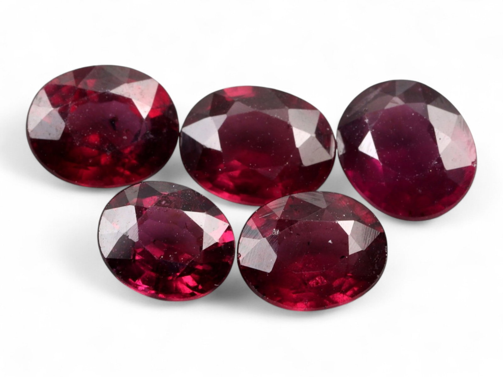 5.95 Carats Deep Red Faceted Garnet Parcel - Natural Mozambique Stones: This richly colored parcel of faceted garnets glows with a deep crimson tone accented by flashes of wine-red brilliance. Each oval gem, averaging 8 x 6 x 3 mm, captures light with elegant depth and in