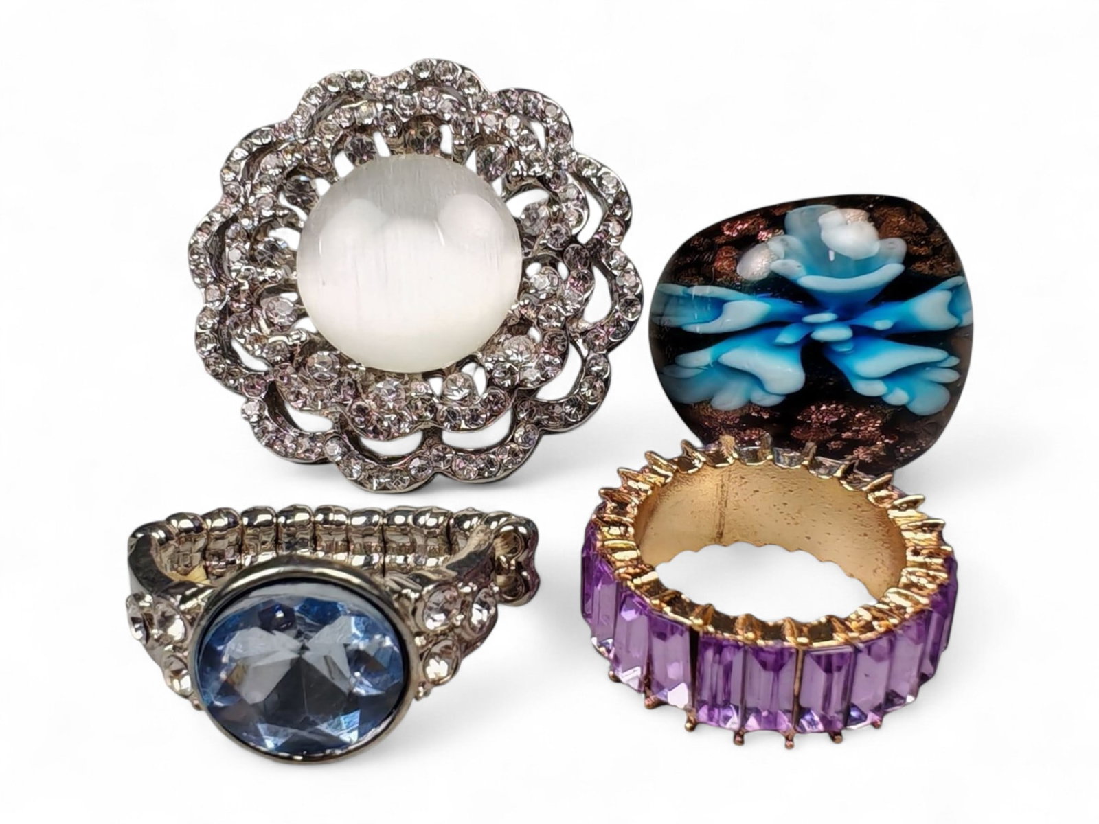 Lot of 4 Vintage and Contemporary Fashion Ring Lot, c. 20th-21st Century: This assorted lot of vintage and contemporary fashion rings offers a vibrant collection of statement pieces showcasing diverse styles, materials, and craftsmanship. Designed for decorative wear rather