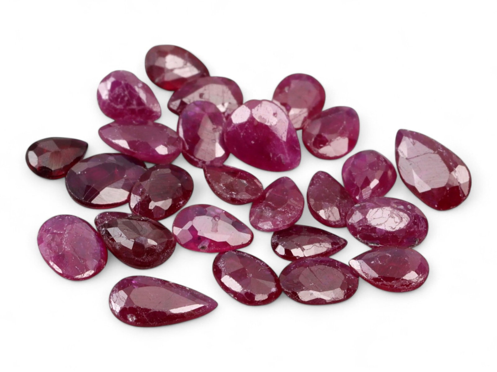 2.69 Carats Vivid Red Ruby Pear Lot - Natural Mozambique Stones: This striking lot of ruby pear gleams with an intense, saturated red hue infused with a touch of magenta, exuding the classic vibrancy that defines fine ruby. Each gem, measuring approximately 4x3.1x2