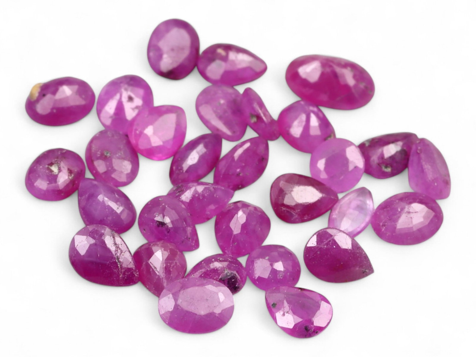 4.13 Carats Vivid Pinkish Red Ruby Mix Lot - Natural Mozambique Stones: This lively lot of ruby pear ovals glows with an intense pinkish-red tone that captures the eye with warmth and vibrancy. Each gem, measuring approximately 4x2x1.7mm, reveals a balance of medium to de