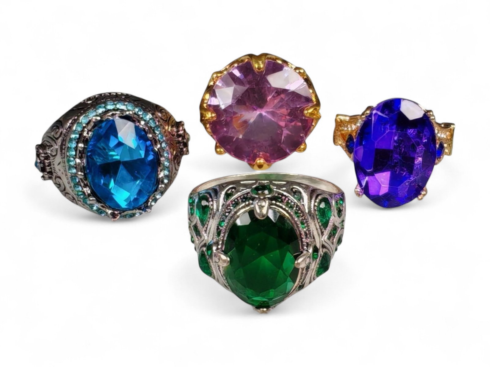 Lot of 4 Vintage and Contemporary Fashion Ring Lot, c. 20th-21st Century: This assorted lot of vintage and contemporary fashion rings offers a vibrant collection of statement pieces showcasing diverse styles, materials, and craftsmanship. Designed for decorative wear rather