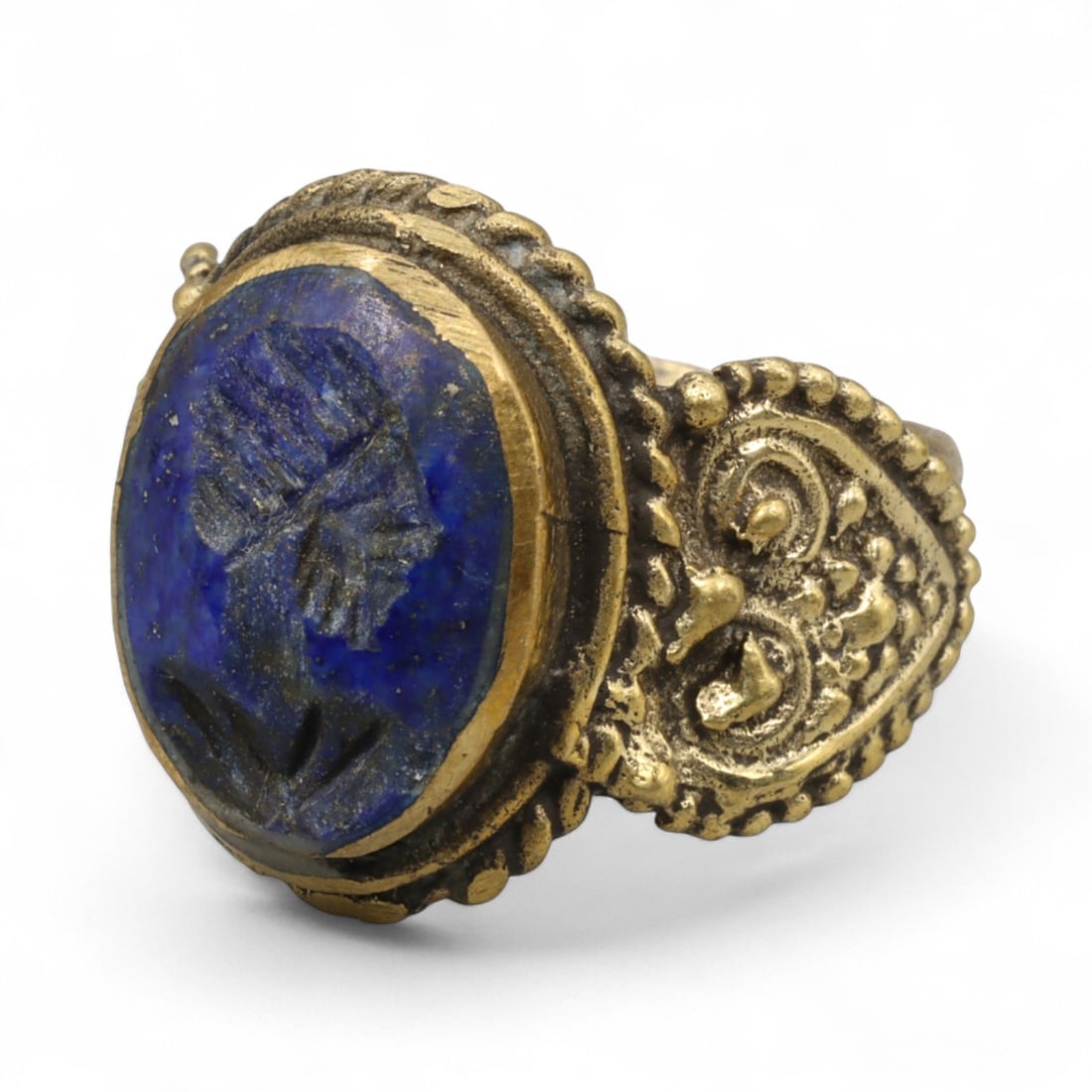 Antique Qajar Gold Gilt Intaglio Signet Ring, c. 19th-20th Century, 9.5 US: This substantial gilt ring, dating to the Qajar era of the 19th-20th century, embodies the regal aesthetic and cultural refinement of Persian jewelry traditions. The bezel is set with an engraved inta