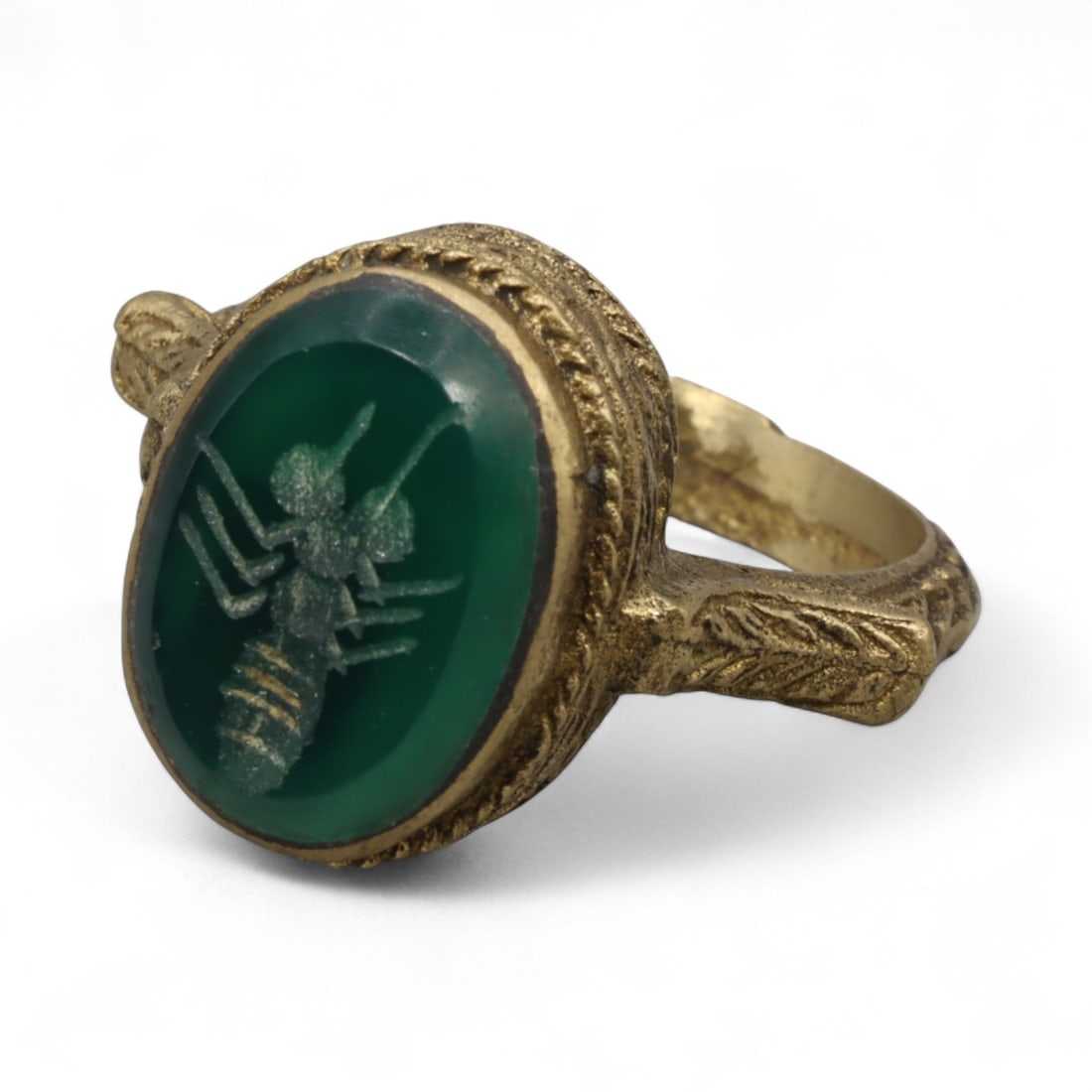 Antique Qajar Gold Gilt Intaglio Signet Ring, c. 19th-20th Century, 9.5 US: This substantial gilt ring, dating to the Qajar era of the 19th-20th century, embodies the regal aesthetic and cultural refinement of Persian jewelry traditions. The bezel is set with an engraved inta