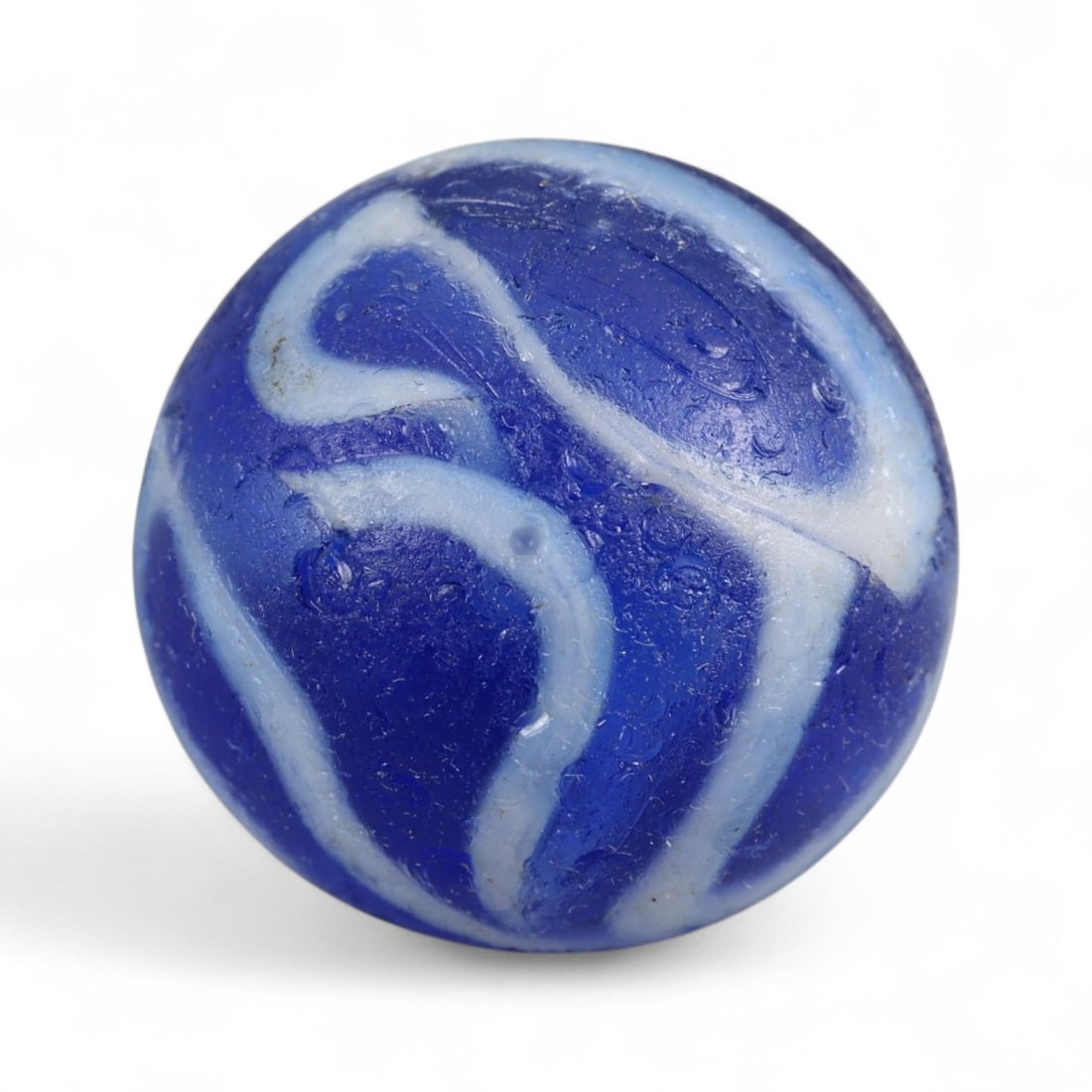 Vintage Handcrafted Glass Marble, Mid-20th Century, 1.7cm: This vintage glass marble represents a fine example of mid-20th century craftsmanship, showcasing the artistry and precision of traditional glassworking before the dominance of industrial production. 