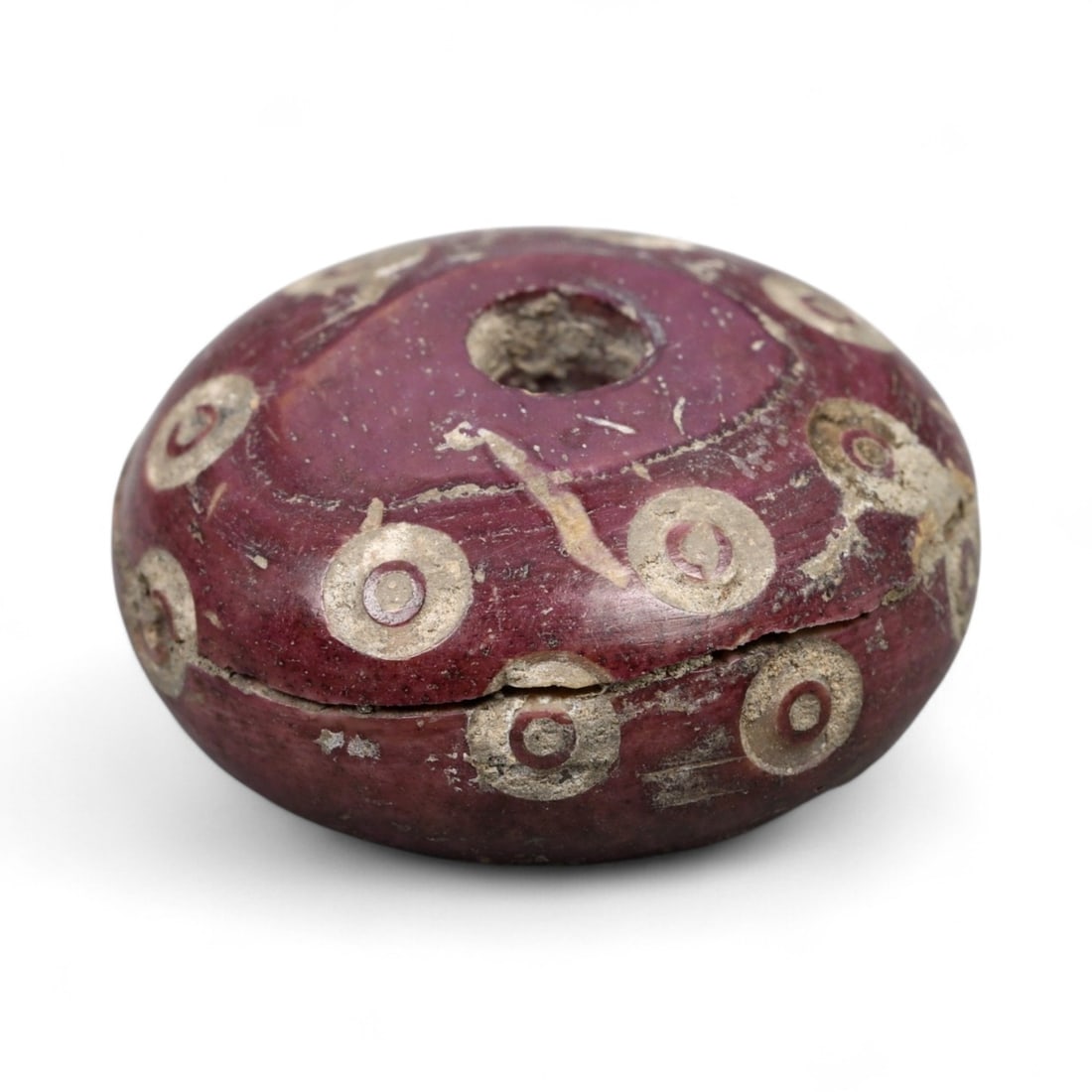 Ancient Medieval Nishapur Silk Road Bone Spindle Whorl, c. 9th-11th Century CE, 1.8cm: This finely carved spindle whorl originates from Nishapur, an important Silk Road city in medieval northeastern Iran, dating to approximately the 9th-11th century CE. Such spindle whorls were essentia