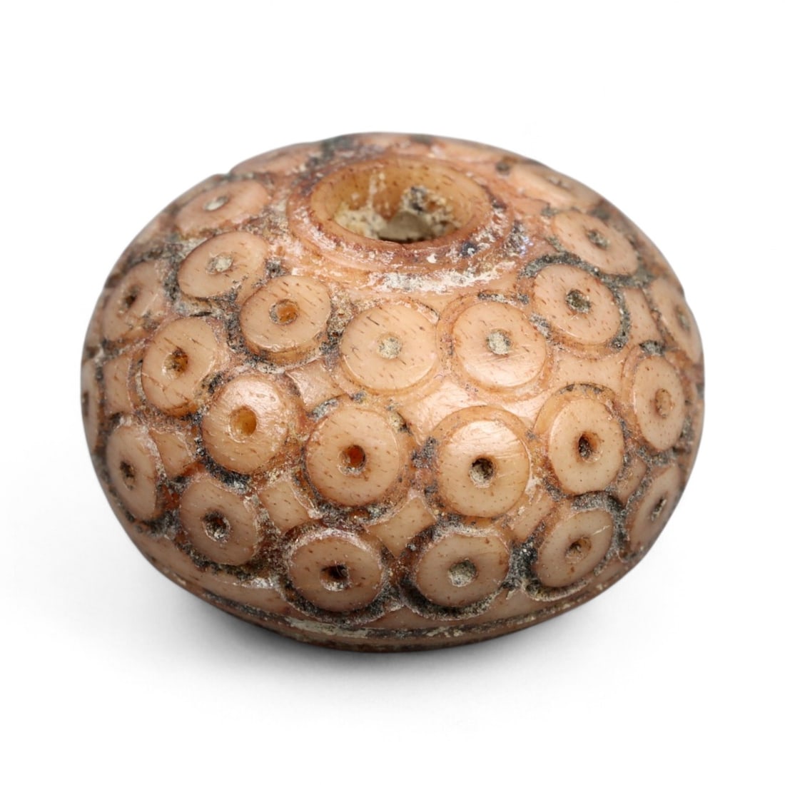 Ancient Medieval Nishapur Silk Road Bone Spindle Whorl, c. 9th-11th Century CE, 1.5cm: This finely carved spindle whorl originates from Nishapur, an important Silk Road city in medieval northeastern Iran, dating to approximately the 9th-11th century CE. Such spindle whorls were essentia