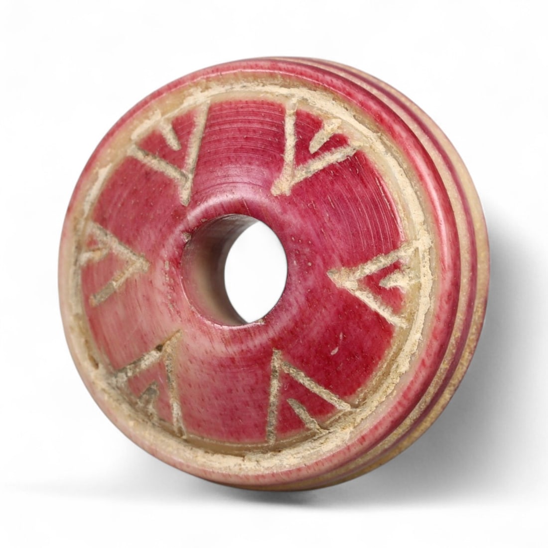 Ancient Medieval Nishapur Silk Road Bone Spindle Whorl, c. 9th-11th Century CE, 1.6cm: This finely carved spindle whorl originates from Nishapur, an important Silk Road city in medieval northeastern Iran, dating to approximately the 9th-11th century CE. Such spindle whorls were essentia