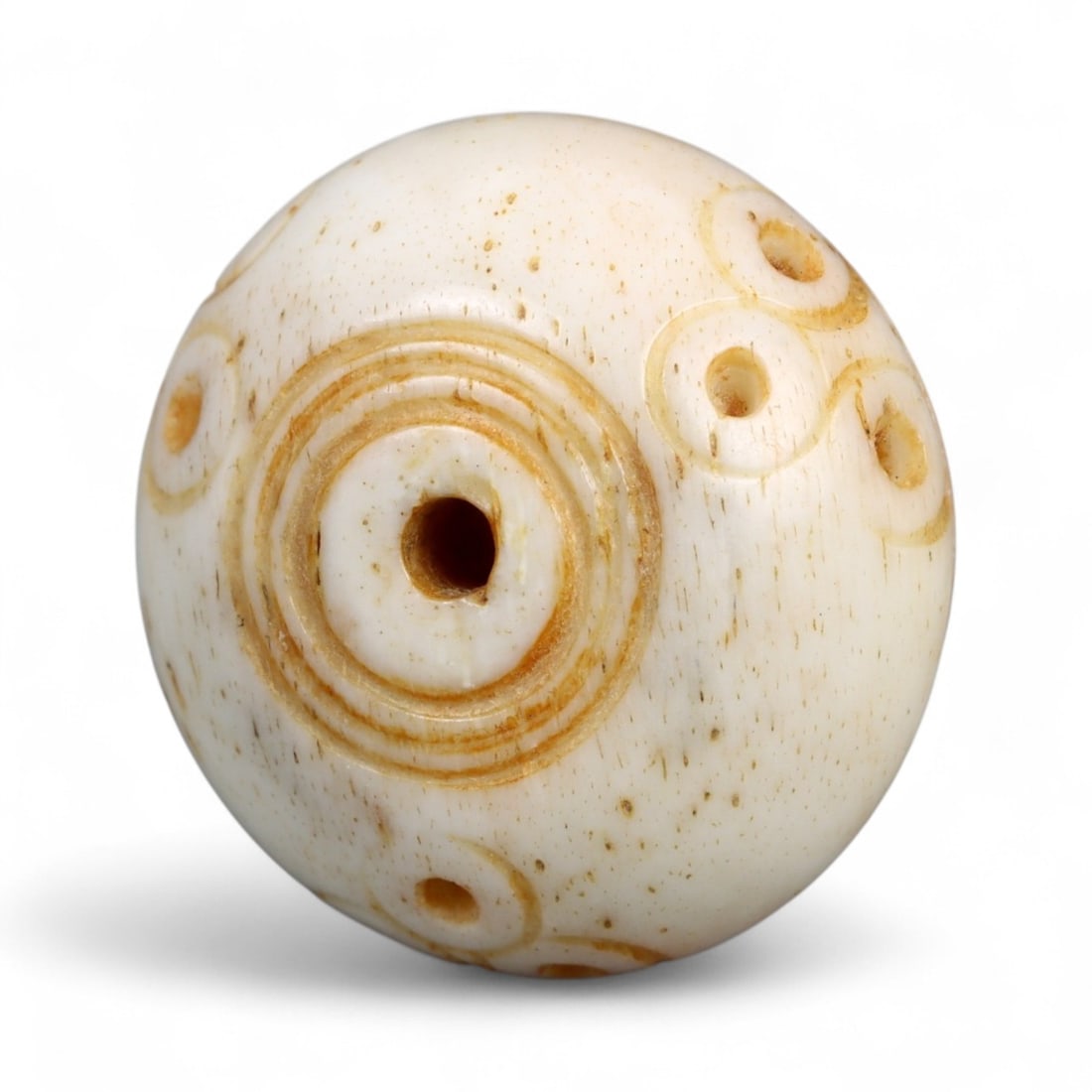 Ancient Medieval Nishapur Silk Road Bone Spindle Whorl, c. 9th-11th Century CE, 1.5cm: This finely carved spindle whorl originates from Nishapur, an important Silk Road city in medieval northeastern Iran, dating to approximately the 9th-11th century CE. Such spindle whorls were essentia